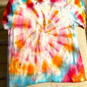 It’s a tie-dye T-shirt and it’s a  small
